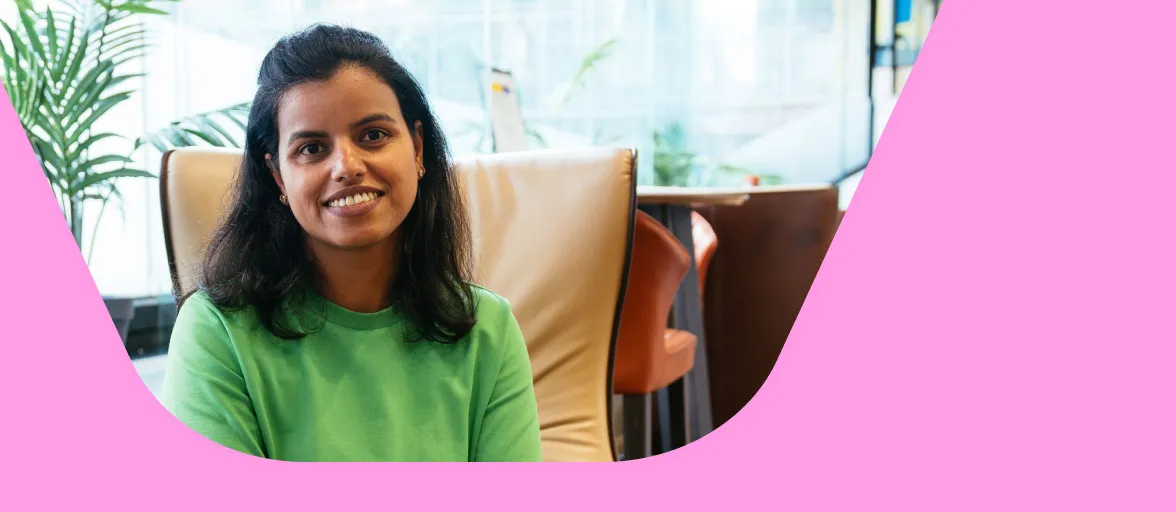 A female tech employee sits in an Aviva breakout space