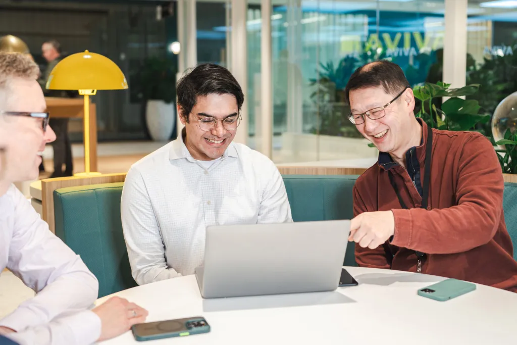 Two colleagues from the Aviva digital team are working together