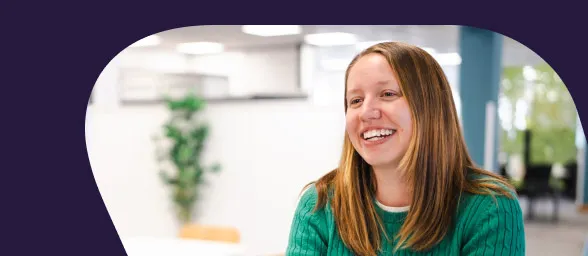 An Aviva HR professional is smiling and having a conversation