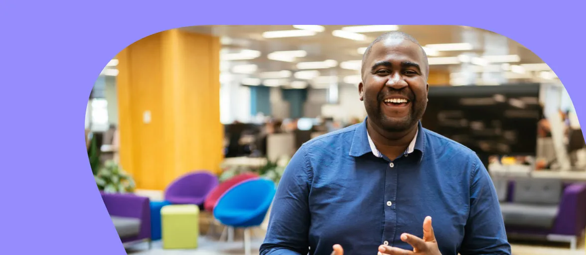 A Claims Handler is smiling in the office 