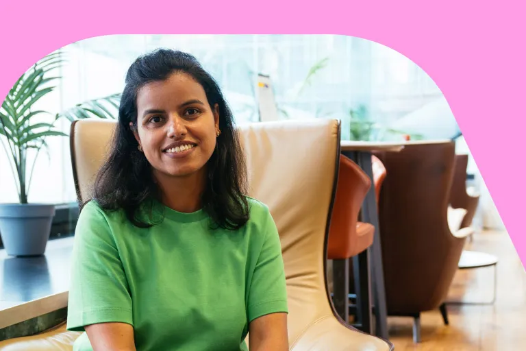 A female tech employee sits in an Aviva breakout space