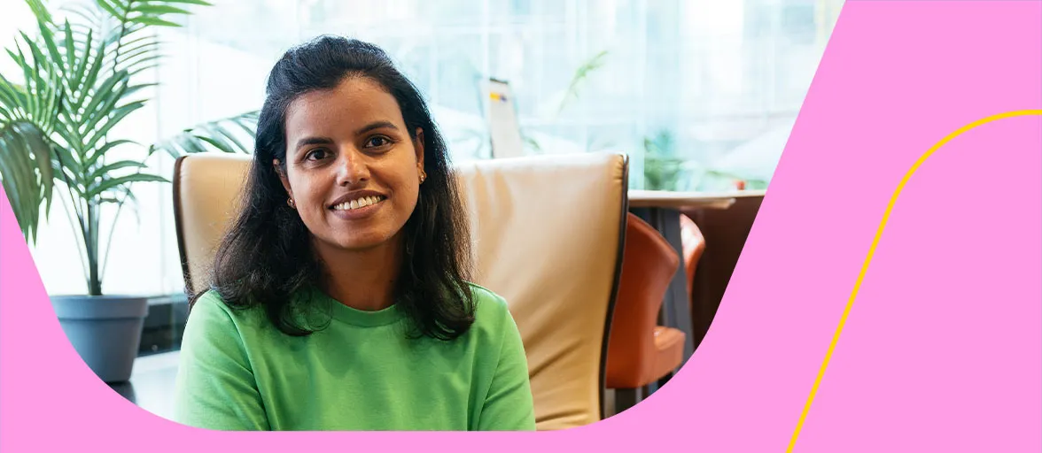 A female tech employee sits in an Aviva breakout space